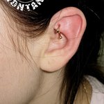 Пирсинг нижней ножки противозавитка, Рук (The Rook Piercing)