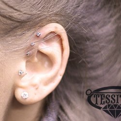 Triple forward helix piercing + Tragus piercing 